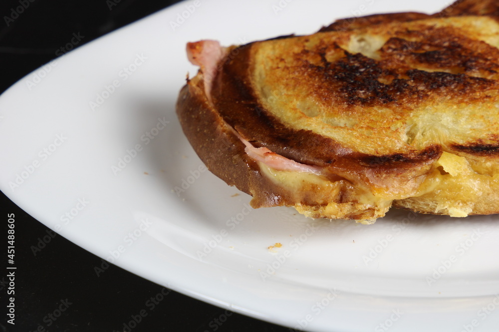 Cheese and Ham sandwich on a plate. Traditional Brazilian sandwich called Misto Quente