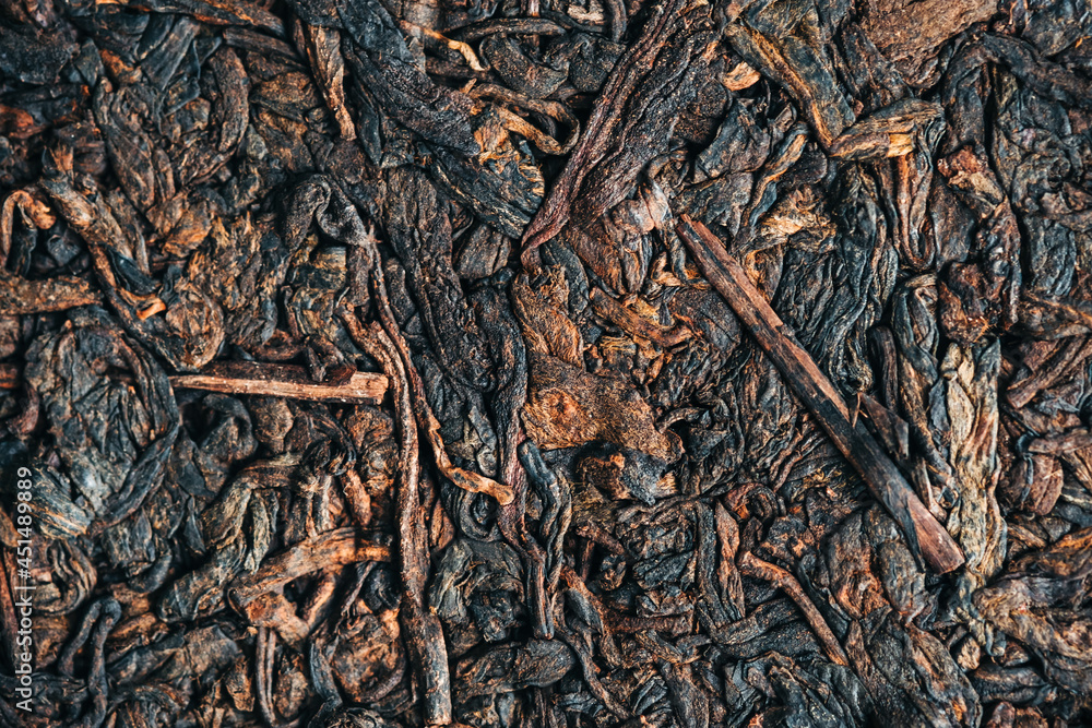Black pressed chinese pu-erh tea, close up. Black pressed chinese pu-erh tea, close up.