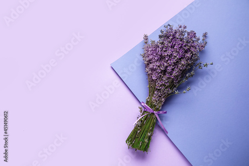 Bouquet of lavender flowers on color background photo