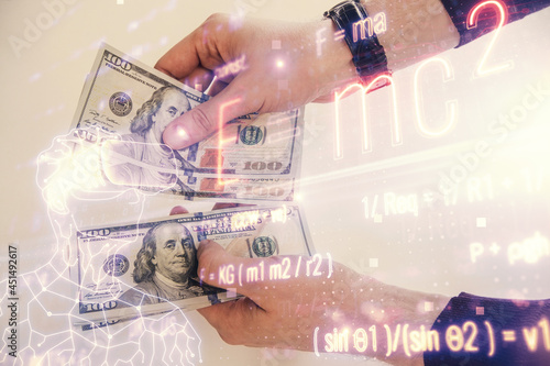 Multi exposure of Formulas drawing hologram and USA dollars bills and man hands. Education