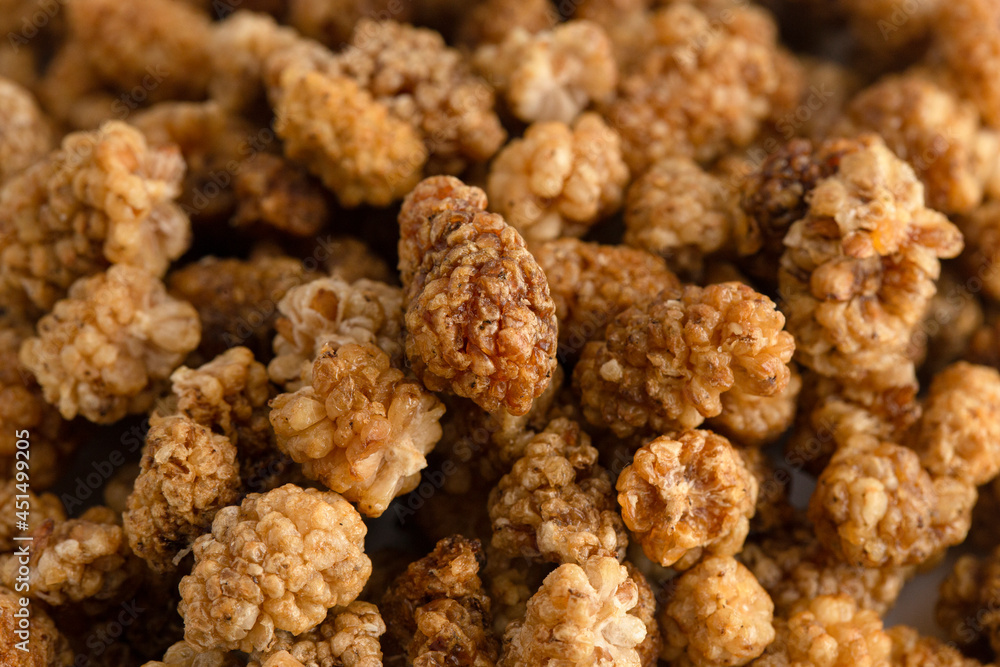 A Background of White Organic Dried Mulberries A Background of White Organic Dried Mulberries