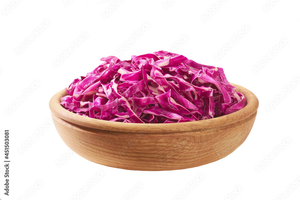 chopped red cabbage in a wooden bowl isolated on white background.