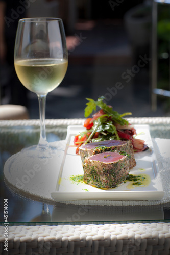 tuna with a glass of white wine