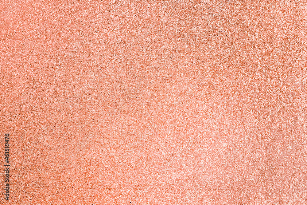 Close up of peach glitter textured background Close up of peach glitter textured background