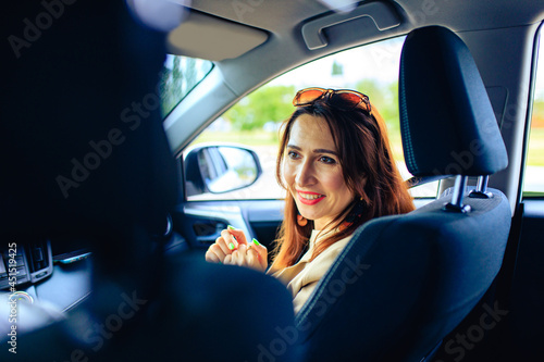 brunette middle age student woman in new car outdoor summer day © yurakrasil