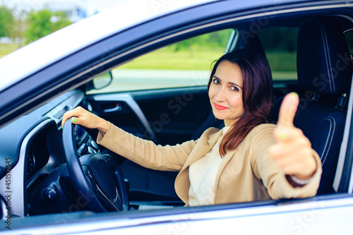Wallpaper Mural brunette middle age student woman in new car outdoor summer day Torontodigital.ca
