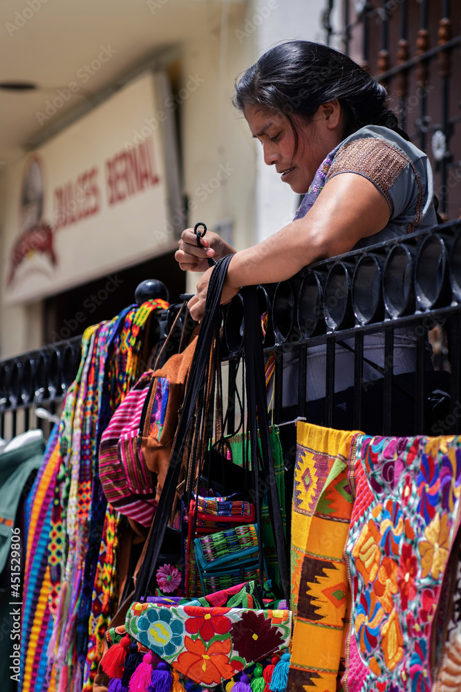 Traditional mexican crafts vendors standing on a railing selling