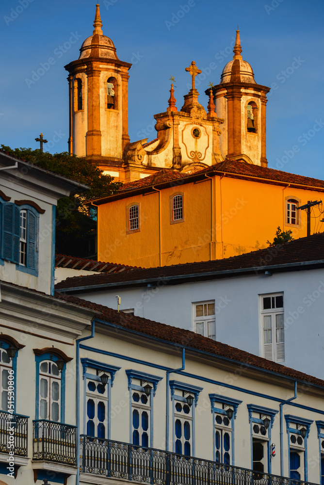 Sunset golden light bathing one of the many baroque churches of the historic colonial town of Ouro Preto, Minas Gerais state, Brazil