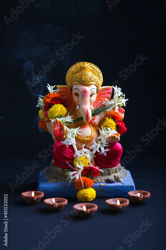 Decorative Lord ganesha sclupture on dark background. photo