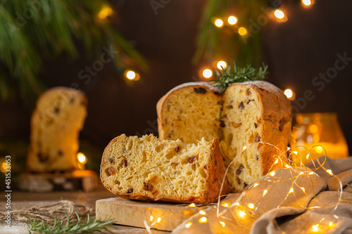 Tableau sur toile Traditional Italian Christmas cake Panettone with festive decorations
