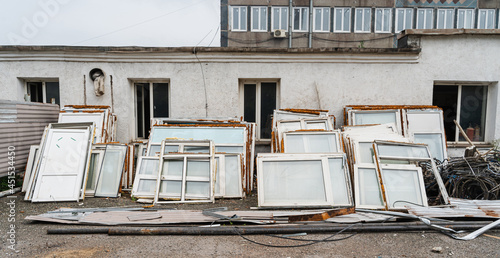 Processing industry, garbage collection and disposal services. A pile of construction waste near a private house. Construction crushed stone, brick, stone, windows. Garbage, garbage accumulated near t