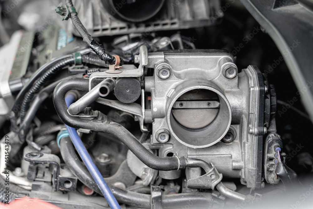 Close up old throttle Body of car in engine room with dust and Soot for repair and clean in process with engine room Close up old throttle Body of car in engine room with dust and Soot for repair and clean in process with engine room