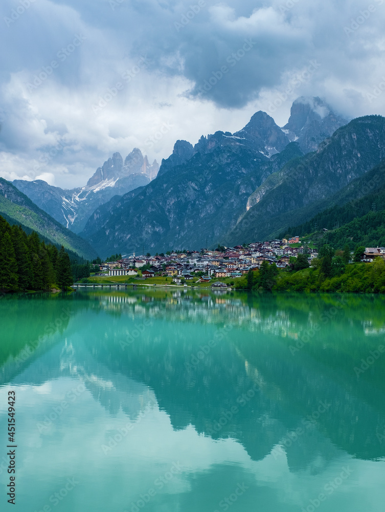 Dolomite mountains reflecting in the Mizurina lake, Italy