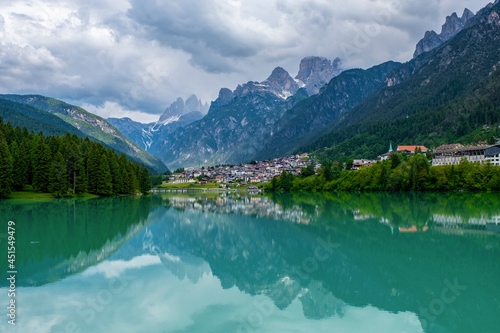 Dolomite mountains reflecting in the Mizurina lake, Italy © Oksana Perkins