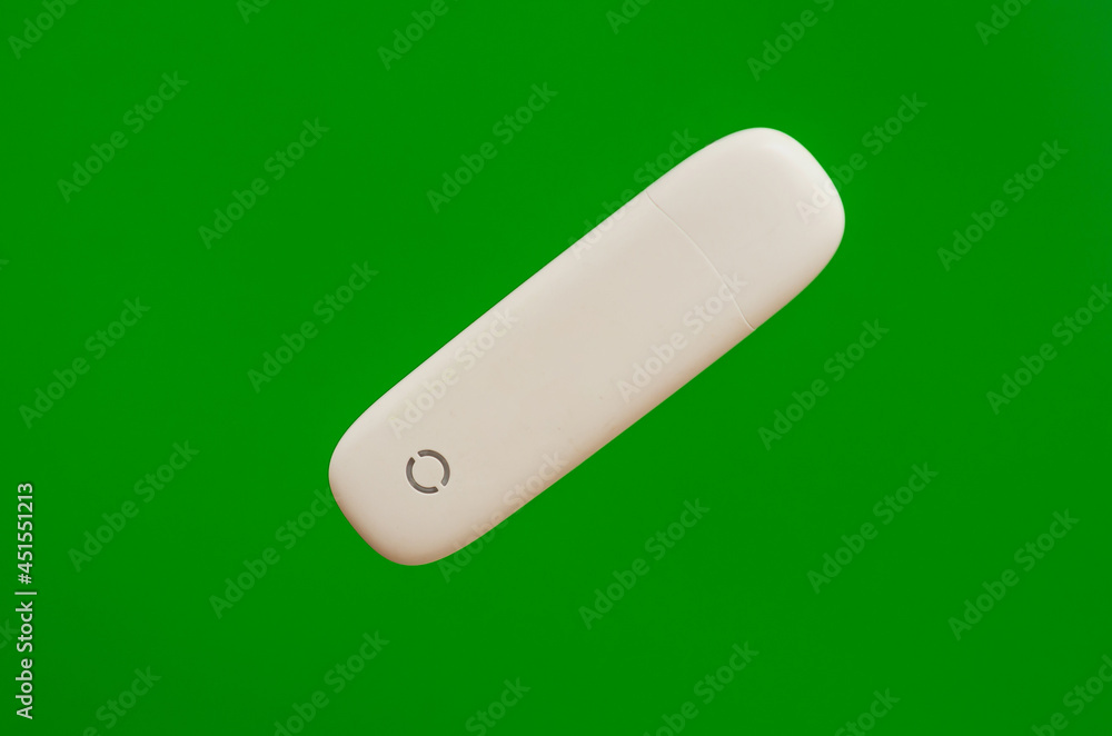 portable modem flash drive for computer and laptop on a green background portable modem flash drive for computer and laptop on a green background