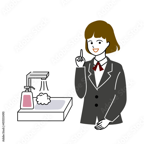 手洗いをうながす女子学生