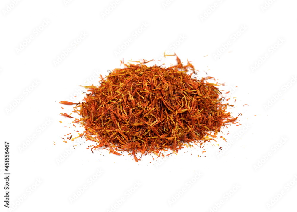Fototapeta premium Saffron spice threads (strands) isolated on white background. Saffron sprinkle on white. Red spice isolated.