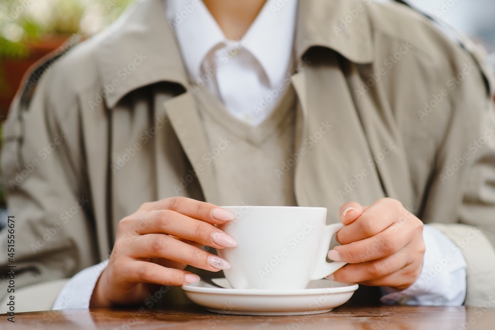 young stylish beautiful woman sitting in city cafe in street, spring fashion trend style, drinking latte, pink purse, exited, emotional, happy, smiling young stylish beautiful woman sitting in city cafe in street, spring fashion trend style, drinking latte, pink purse, exited, emotional, happy, smiling
