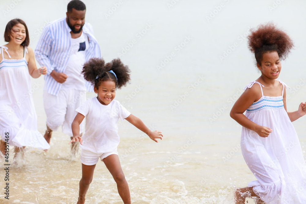 Two African kid playing together on the beach Two African kid playing together on the beach