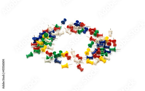 Circular organized paper push pins on an isolated white background