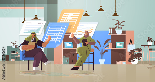 arab businesspeople analyzing statistic data on virtual boards successful teamwork concept