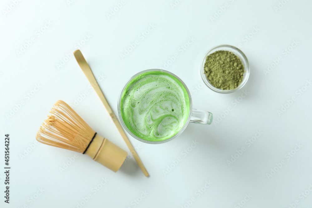 Matcha latte and accessories for making on white background Matcha latte and accessories for making on white background