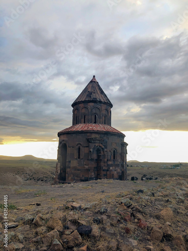 Ani ruins, Kars province, mountains and cloudy sky photo taken at sunset.