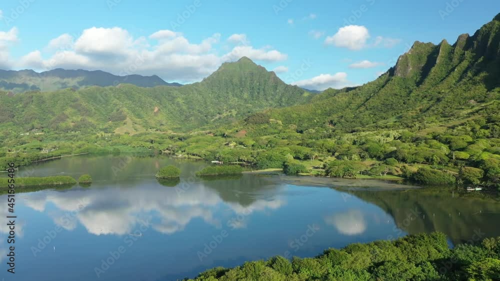 Aerial view of the ancient Moli'i fishponds with reflections of the Koolau mountains in the ponds. The ponds are located near Kaneohe, on the island of Oahu, Hawaii, USA. Aerial view of the ancient Moli'i fishponds with reflections of the Koolau mountains in the ponds. The ponds are located near Kaneohe, on the island of Oahu, Hawaii, USA.