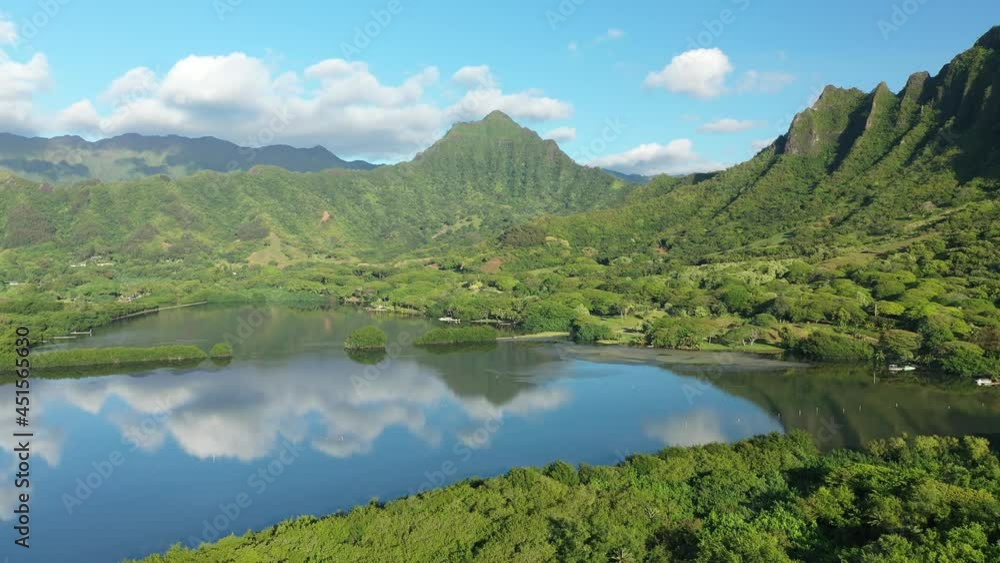 Aerial view of the ancient Moli'i fishponds with reflections of the Koolau mountains in the ponds. The ponds are located near Kaneohe, on the island of Oahu, Hawaii, USA. Aerial view of the ancient Moli'i fishponds with reflections of the Koolau mountains in the ponds. The ponds are located near Kaneohe, on the island of Oahu, Hawaii, USA.