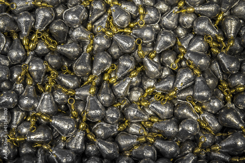 Closeup shot of many lead sinkers for fishing photo