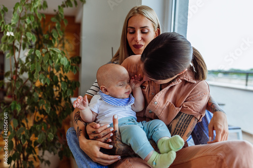 Same sex parents with their kid