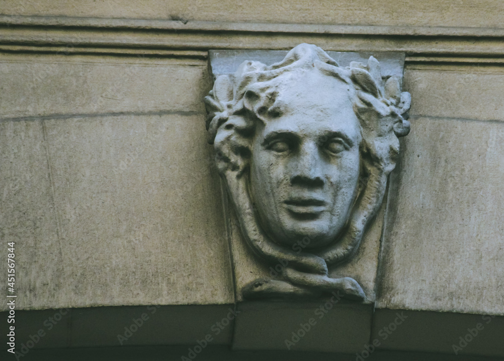 Stone face on facade