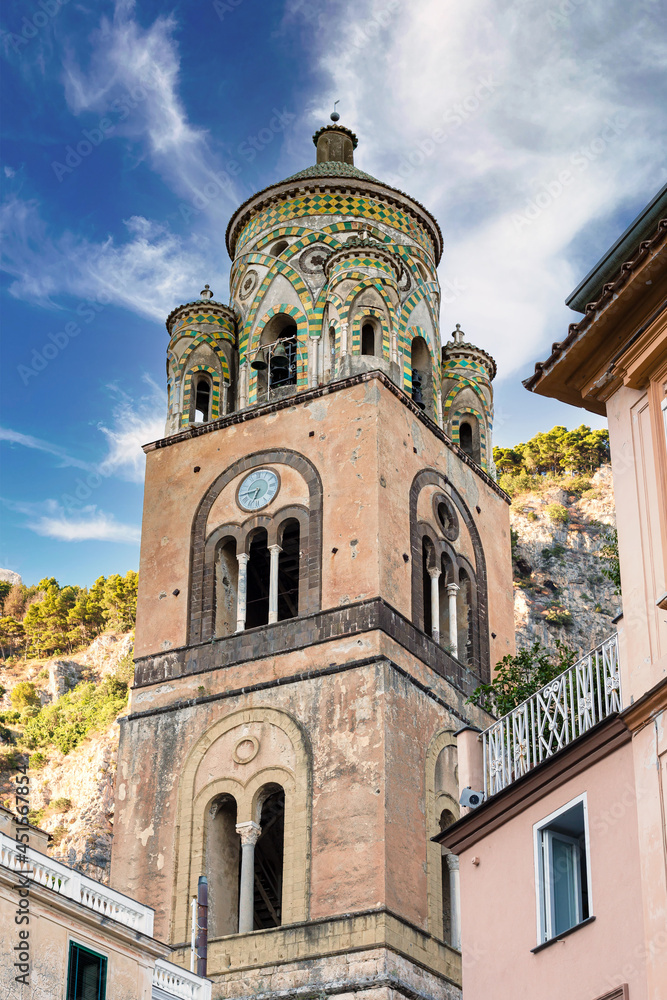 Fototapeta premium Famous and worth seeing bell tower of the historic Amalfi Cathedral in the charming harbour town of Amalfi in Italy