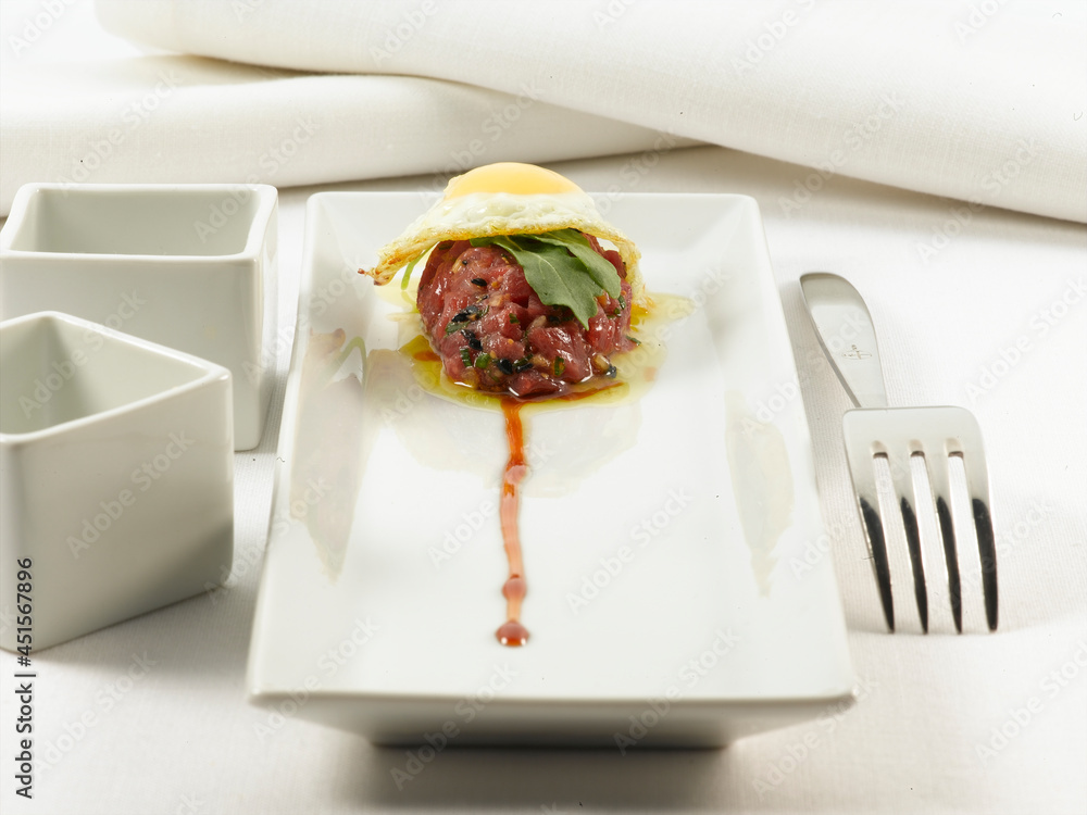Steak tartar de atún con huevo. Tuna steak tartare with egg. Stock