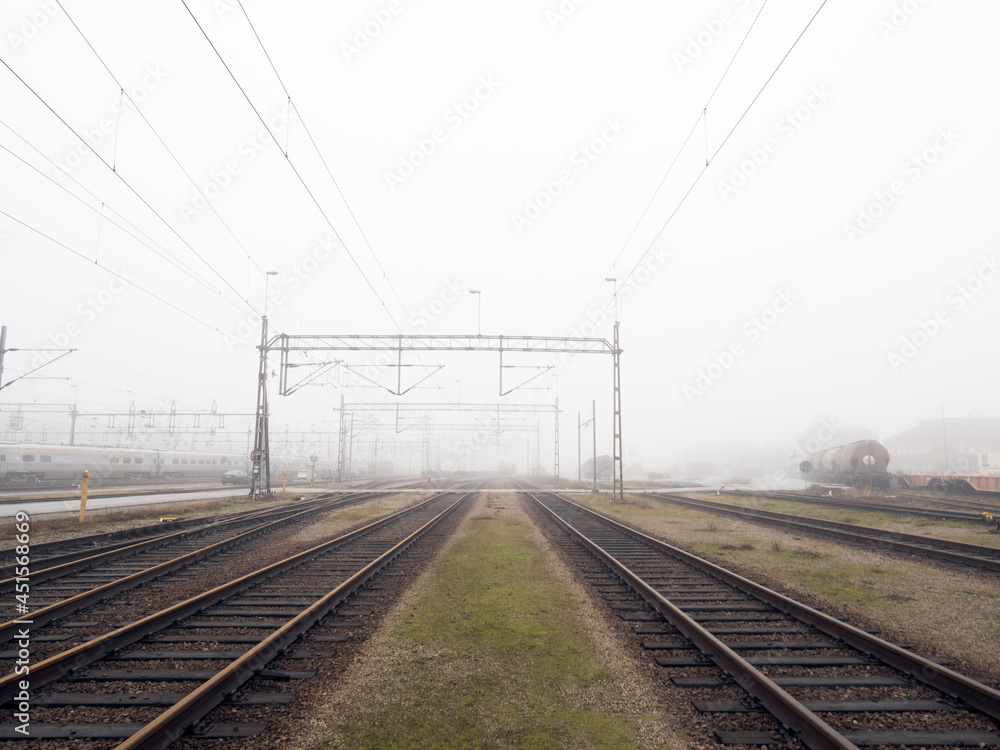 train tracks on a foggy day 