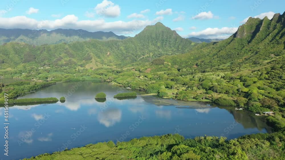 Aerial view of the ancient Moli'i fishponds with reflections of the Koolau mountains in the ponds. The ponds are located near Kaneohe, on the island of Oahu, Hawaii, USA. Aerial view of the ancient Moli'i fishponds with reflections of the Koolau mountains in the ponds. The ponds are located near Kaneohe, on the island of Oahu, Hawaii, USA.