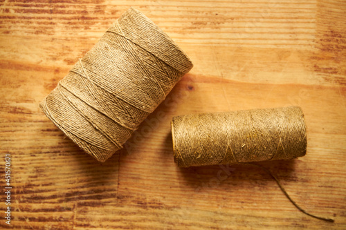 two spools of twine on a wooden table, sewing, twine