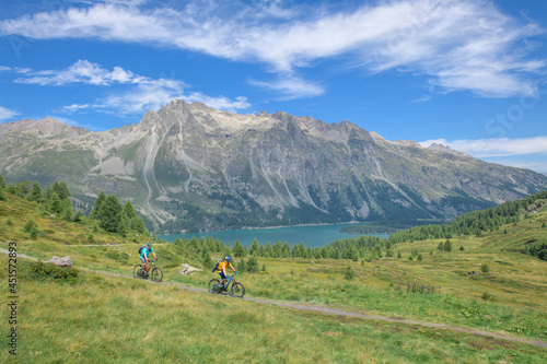Pair of cyclists during a mountain bike excursion on the Alps