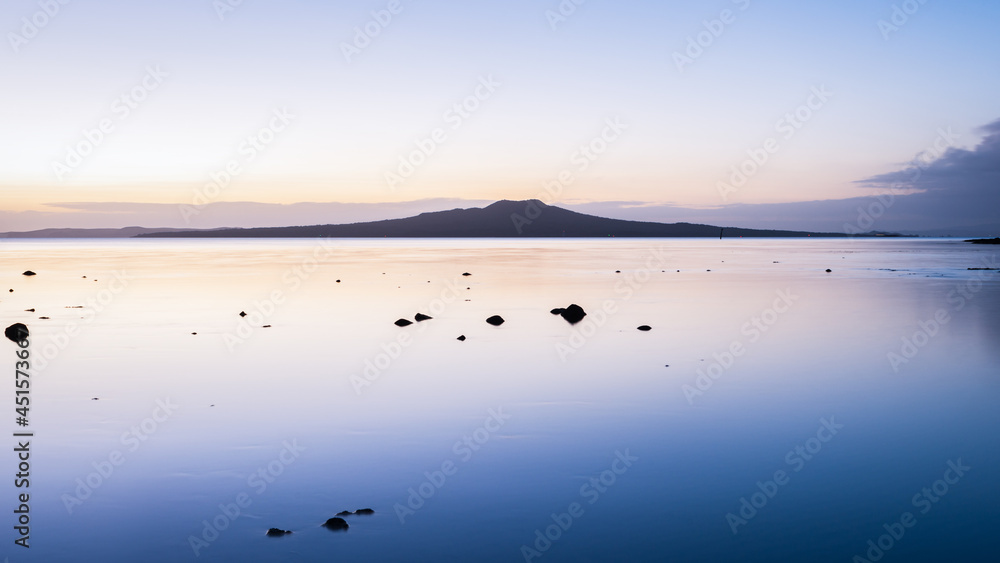 Tranquillity image of Rangitoto Island at dawn, Milford Beach, Auckland
