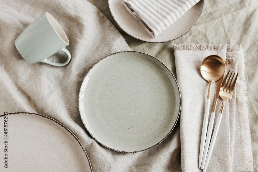 Ceramic plates mockup on modern minimal table place setting neutral beige color top view. Space for text or menu .Scandinavian style. Business food brand template. Ceramic plates mockup on modern minimal table place setting neutral beige color top view. Space for text or menu .Scandinavian style. Business food brand template.