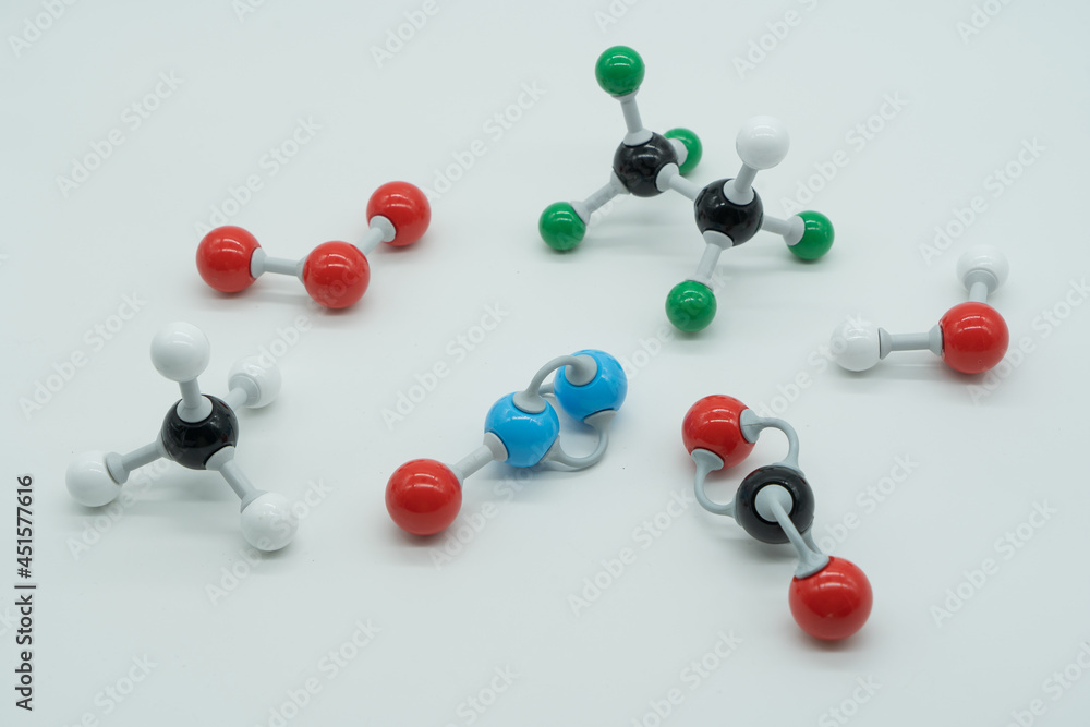 Picture of different greenhouse gases made by molecular model on white