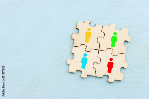 business concept image of puzzle blocks with people icons ,human resources and management concept