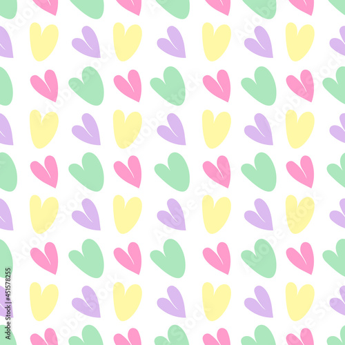 Seamless vector pattern with colored hearts on a white background