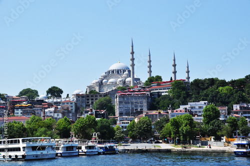Panoramic view of Istanbul. Panorama of the Golden Horn Bay and the coastline with ships, residential buildings and the Suleymaniye Mosque. July 09, 2021, Istanbul, Turkey.