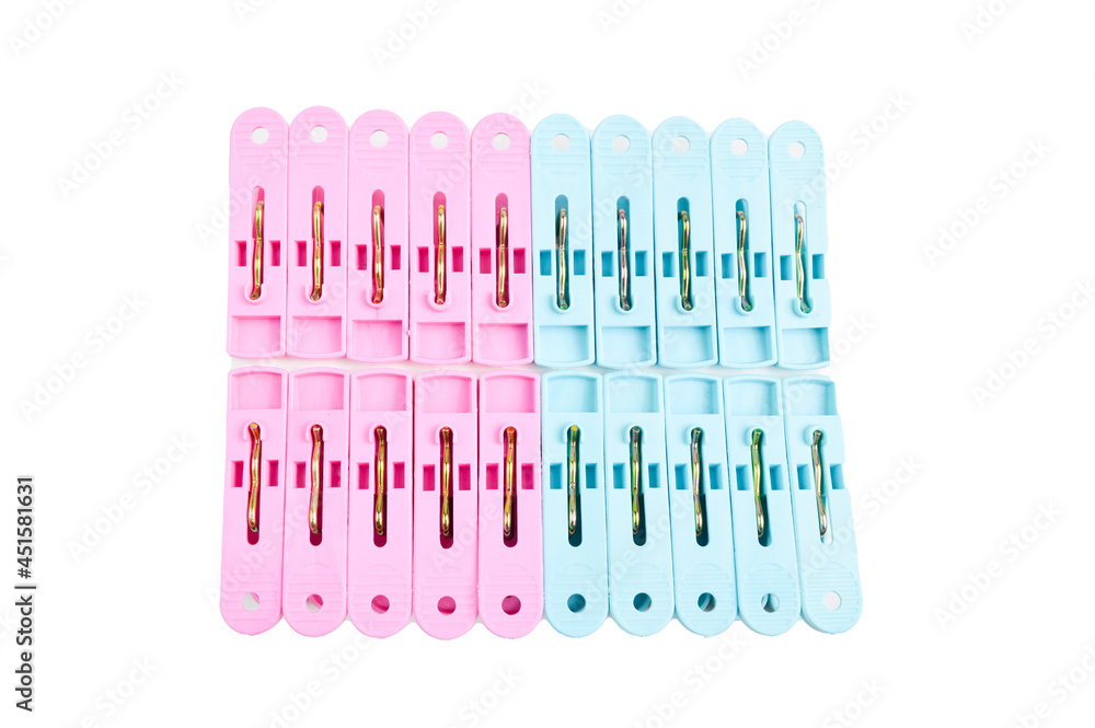 Plastic clothespins in a row isolated on a white background