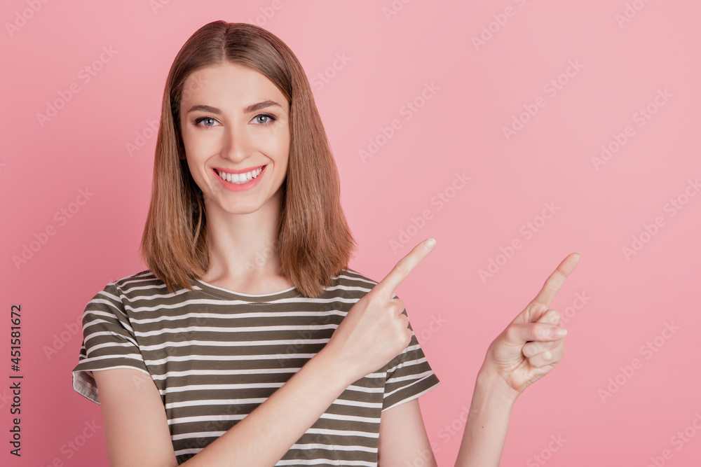 Portrait of reliable nice attractive lady indicate forefinger empty space on pink background Portrait of reliable nice attractive lady indicate forefinger empty space on pink background