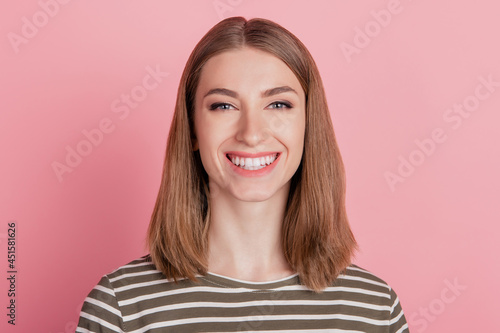 Portrait of charming pretty cheerful lady beaming smile good mood nice person on pink background