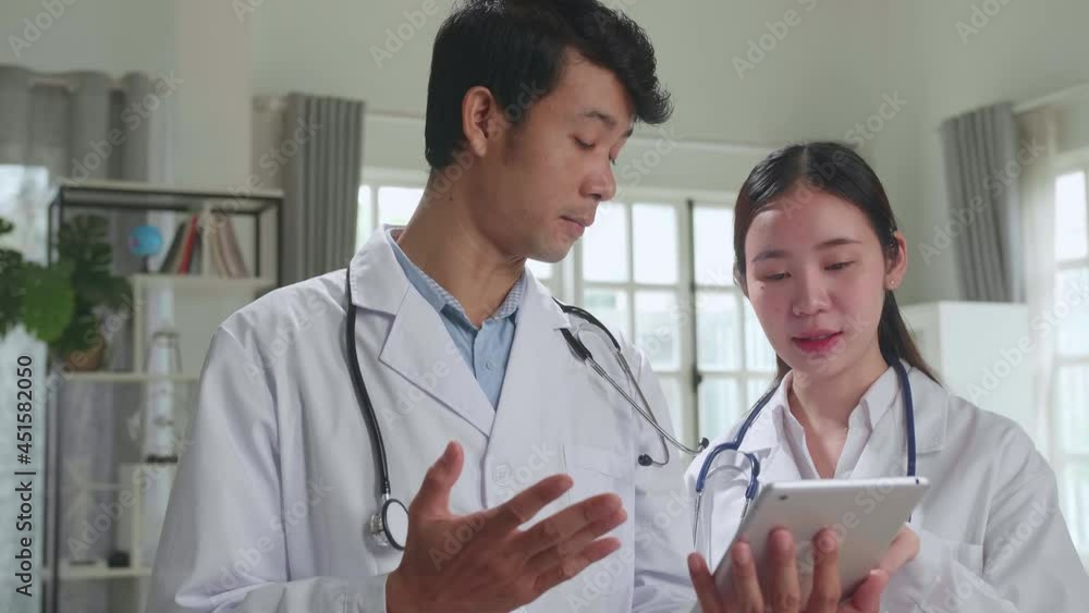 Doctor'S Office: Asian Physician Talks With Professional Nurse, Using Tablet Computer. Medical Health Care Specialists Discuss Test Results, Prescription Medicine, Patient Treatment
Doctor'S Office: Asian Physician Talks With Professional Nurse, Using Tablet Computer. Medical Health Care Specialists Discuss Test Results, Prescription Medicine, Patient Treatment