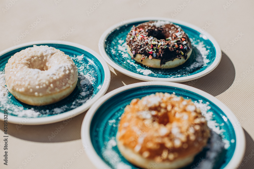 Fresh delicious donuts on plate Fresh delicious donuts on plate