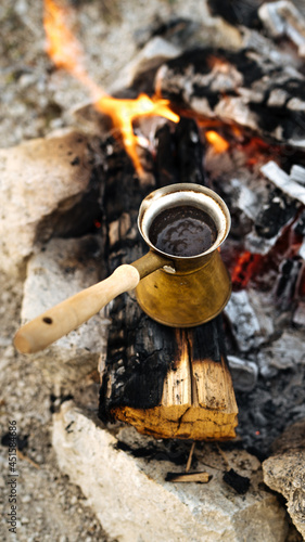 Morning coffee on a campfire while hiking